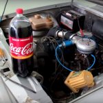 Is it possible to clean limestone deposits from a radiator using Coca-Cola?