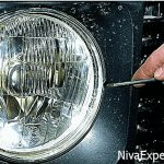 The Niva headlight adjustment screw is located