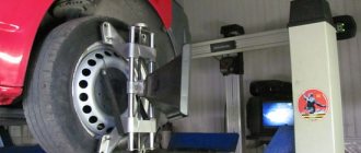 wheel alignment adjustment on a stand